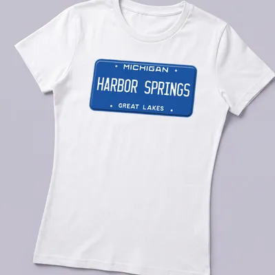 Vintage-style T-shirt featuring a Michigan Harbor Springs license plate graphic — printed on a women's shirt