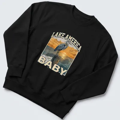 Vintage heron silhouette at sunset with Lake America Baby text — printed on a unisex sweatshirt