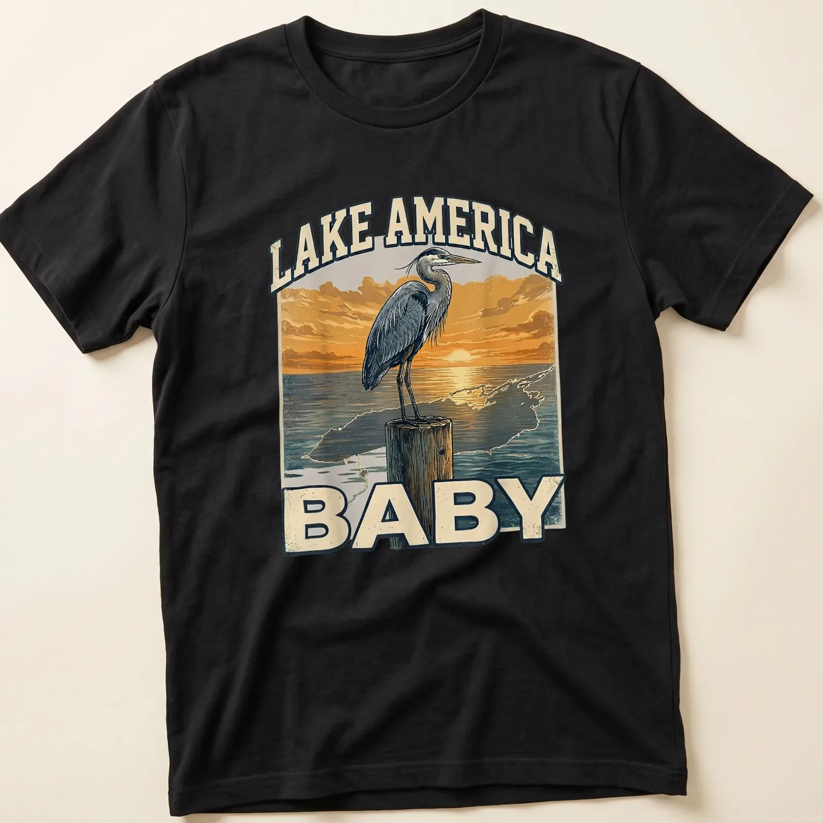 Vintage heron silhouette at sunset with Lake America Baby text — printed on a unisex t-shirt