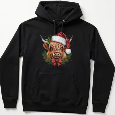 Realistic illustration of a Highland cow in a Santa hat surrounded by a winter wreath — printed on a unisex hoodie