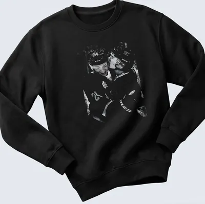 Artistic vintage print of hockey players in rivalry in black and white — printed on a unisex sweatshirt