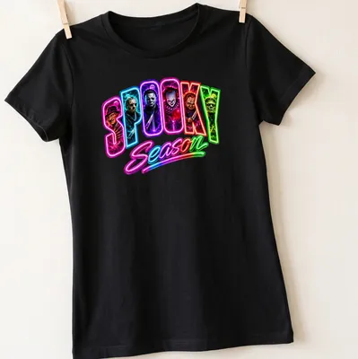 Neon horror movie villains graphic with 'SPOOKY Season' text in vivid colors — printed on a women's shirt