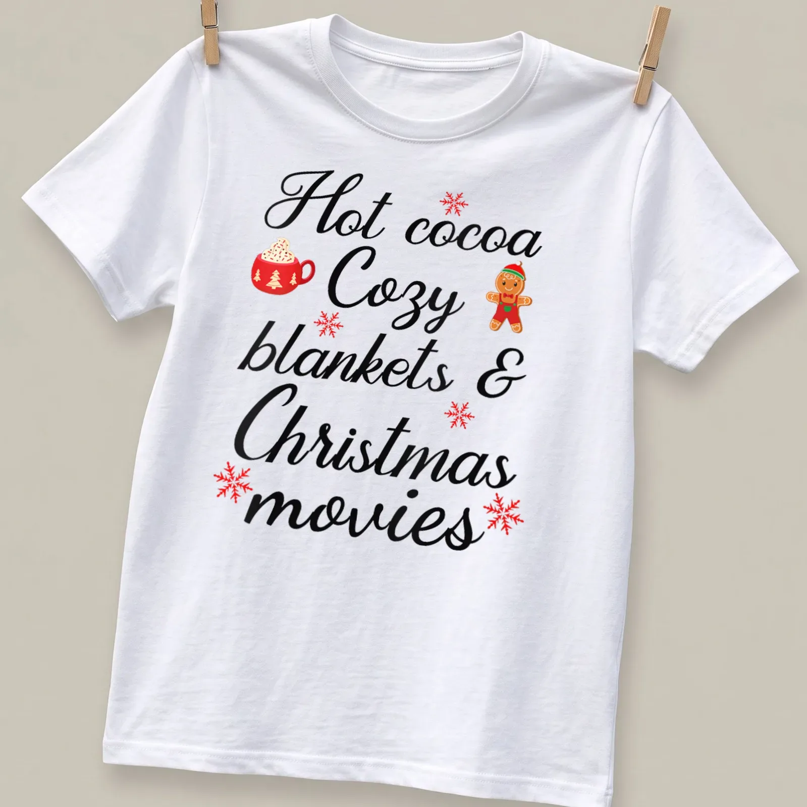 Cute typography shirt with hot cocoa, cozy blankets, and Christmas movies design — printed on a unisex t-shirt
