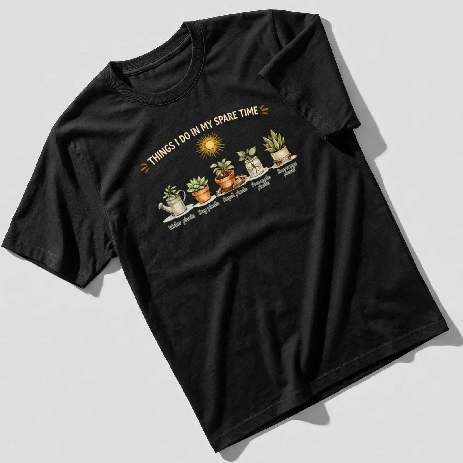 Watercolor print of houseplants with the text 'Things I Do In My Spare Time' — printed on a unisex t-shirt