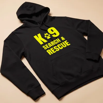 Yellow typography shirt featuring K9 Search & Rescue text — printed on a unisex hoodie