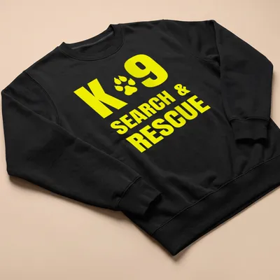 Yellow typography shirt featuring K9 Search & Rescue text — printed on a unisex sweatshirt