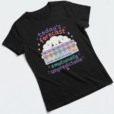Kawaii cloud design with playful text about unpredictable emotions in pastel colors — printed on a women's shirt