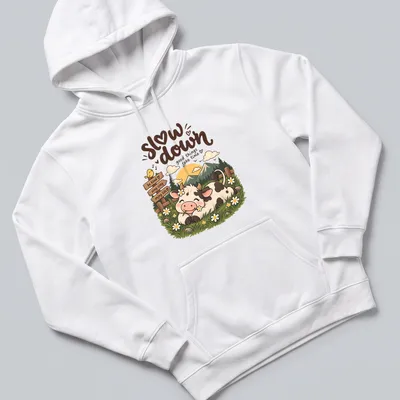 Kawaii cow design with colorful text encouraging kindness and enjoying life — printed on a unisex hoodie