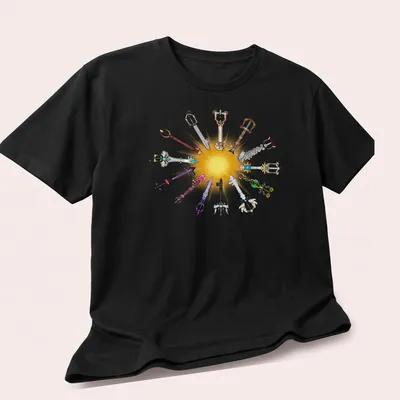 Illustration of various Keyblades in gold, blue, purple, red, black, and silver — printed on a unisex t-shirt (angled view)