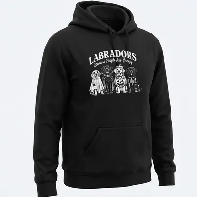 Funny cartoon t-shirt featuring Labradors in Halloween costumes and text — printed on a unisex hoodie