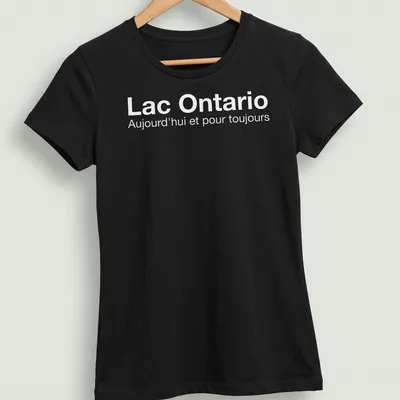 Minimalist Lake Ontario t-shirt with white text expressing timeless love for the lake — printed on a women's shirt