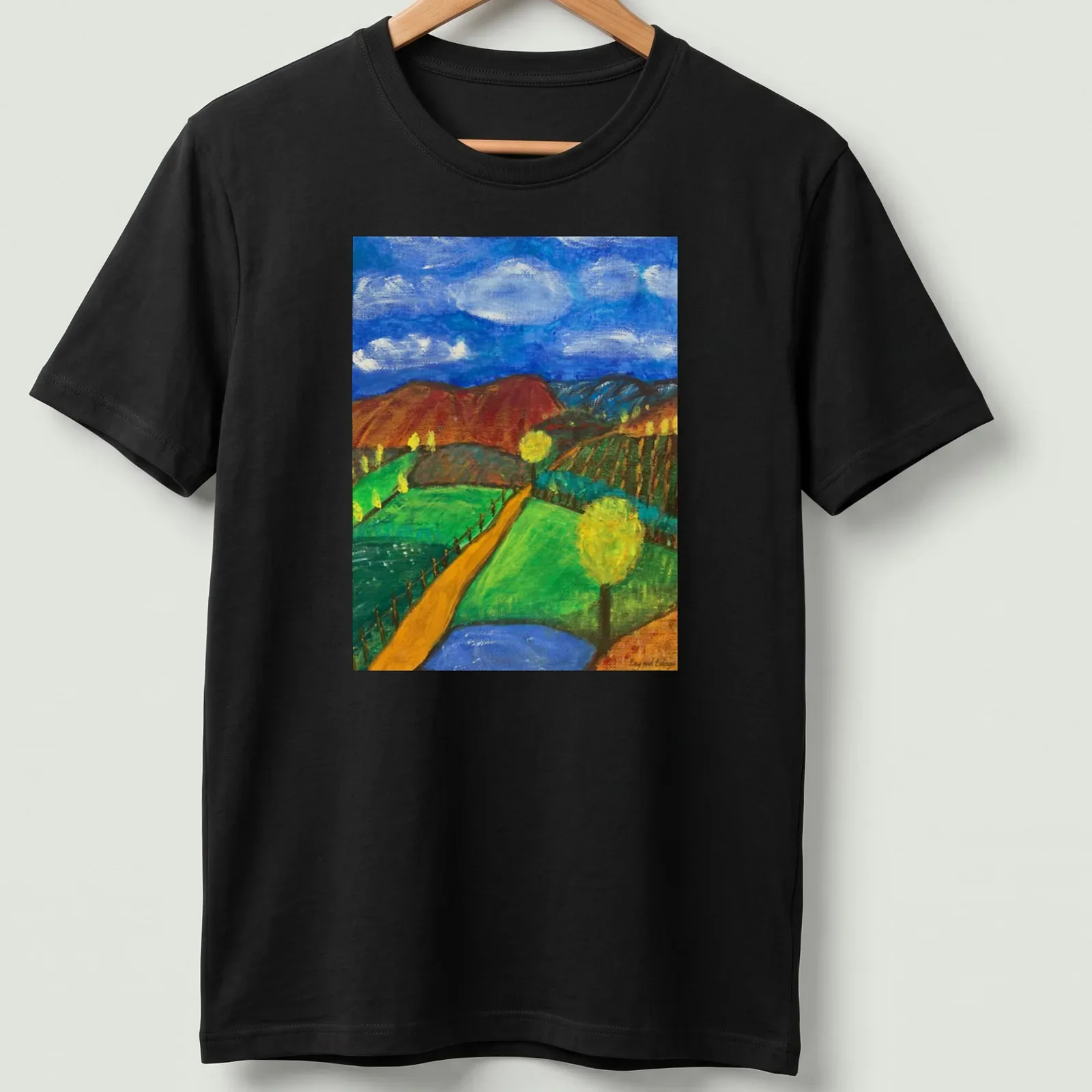 Impressionistic landscape T-shirt featuring hills and trees in various colors — printed on a unisex t-shirt