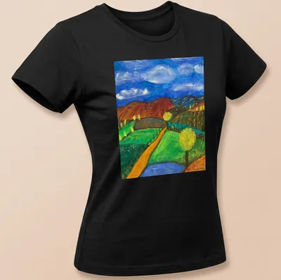 Impressionistic landscape T-shirt featuring hills and trees in various colors — printed on a women's shirt