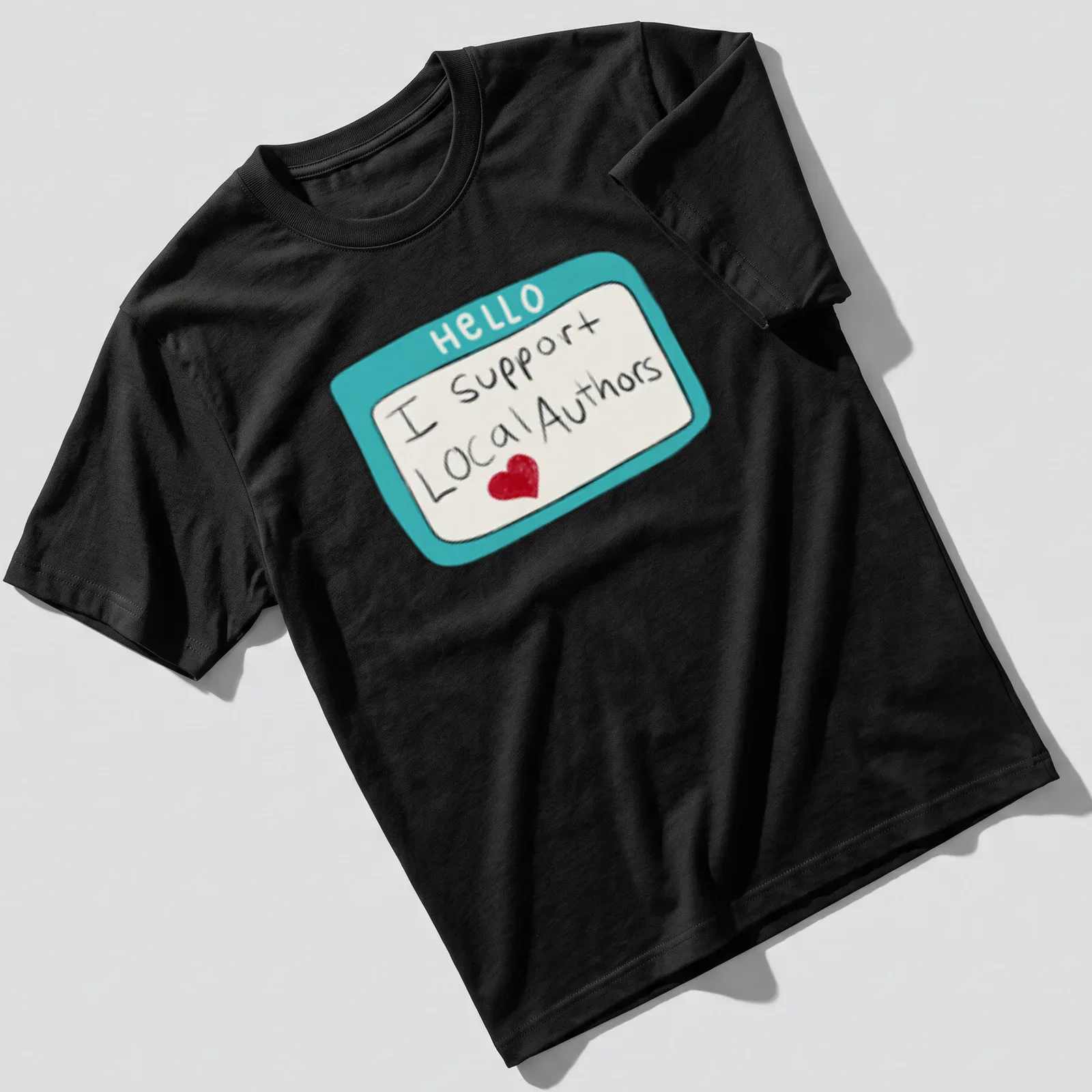 Playful illustration of a name tag with 'HELLO I support Local Authors' text in turquoise and red. — printed on a unisex t-shirt