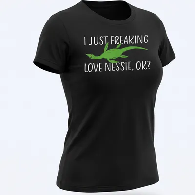 Cartoon Loch Ness Monster with humorous text about loving Nessie — printed on a women's shirt