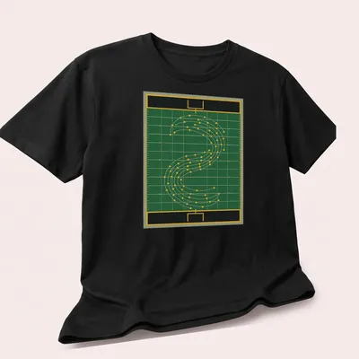 Illustration of a marching band field diagram in green, yellow, black, and white — printed on a unisex t-shirt (angled view)