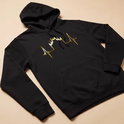 Minimalist illustration of the Milan skyline in gold with heartbeat motif — printed on a unisex hoodie