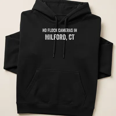 Bold text graphic stating No Flock Cameras in Milford, CT on a grey background — printed on a unisex hoodie