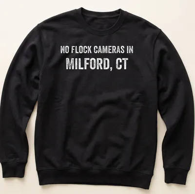 Bold text graphic stating No Flock Cameras in Milford, CT on a grey background — printed on a unisex sweatshirt