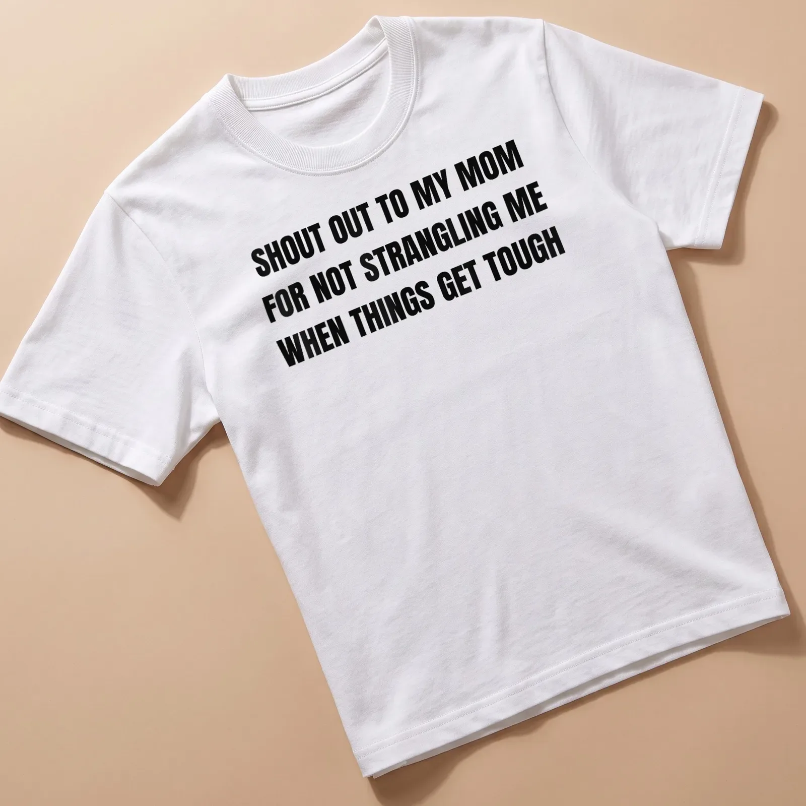 Bold typographic T-shirt humorously appreciating moms for their patience. — printed on a unisex t-shirt