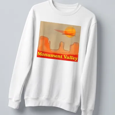 Watercolor print of Monument Valley with sunset colors of orange, yellow, red, and beige — printed on a unisex sweatshirt