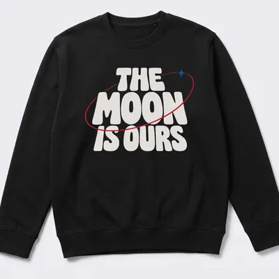 Bold typography T-shirt featuring the phrase 'THE MOON IS OURS' alongside a moon graphic — printed on a unisex sweatshirt
