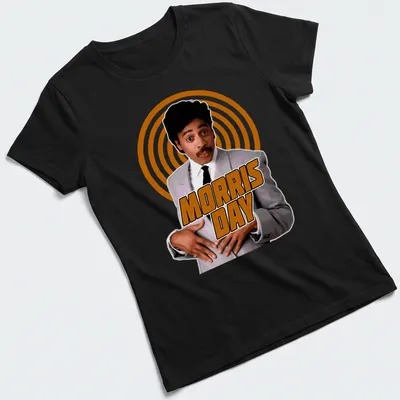 Retro t-shirt with vibrant Morris Day text in orange, white, and black — printed on a women's shirt