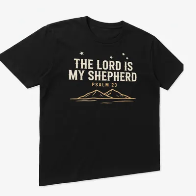 Minimalist mountain landscape with text 'The Lord Is My Shepherd Psalm 23' — printed on a unisex t-shirt (angled view)