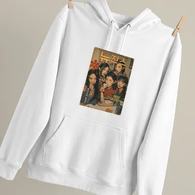 Vintage magazine-style graphic featuring five young women from New Jeans — printed on a unisex hoodie