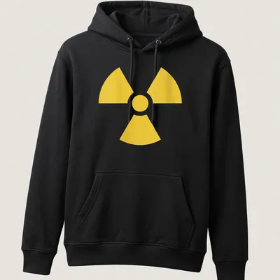 Vintage nuclear warning symbol T-shirt in bold yellow — printed on a unisex hoodie