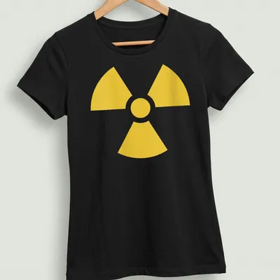 Vintage nuclear warning symbol T-shirt in bold yellow — printed on a women's shirt