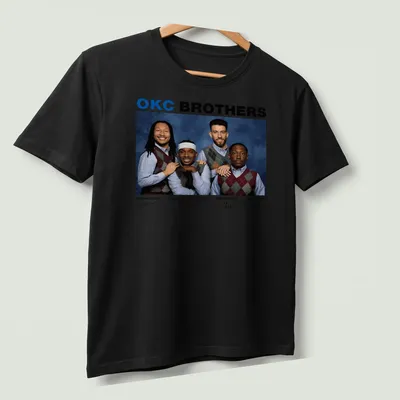 Team photo T-shirt featuring OKC Brothers basketball players in vibrant colors — printed on a unisex t-shirt (angled view)