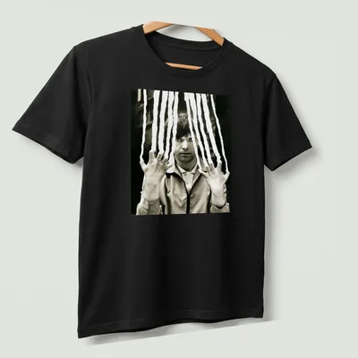 Black and white portrait of Peter Gabriel with a scratched effect — printed on a unisex t-shirt (angled view)