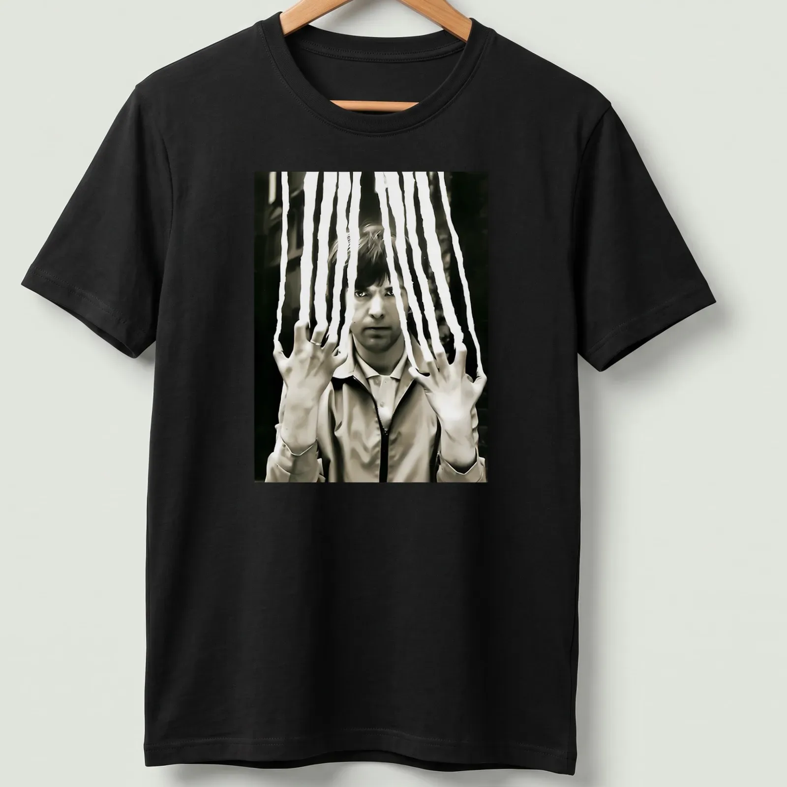 Black and white portrait of Peter Gabriel with a scratched effect — printed on a unisex t-shirt