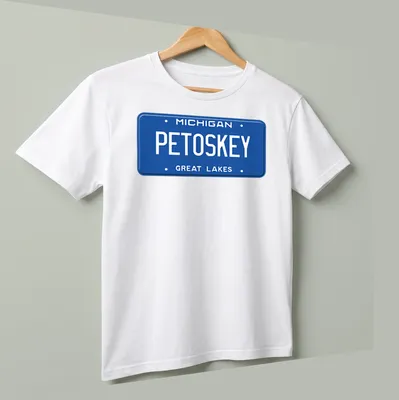 Vintage license plate design featuring Michigan Petoskey Great Lakes text — printed on a unisex t-shirt (angled view)