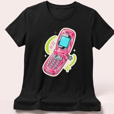 Cartoon design of a pink flip phone with colorful swirls around it. — printed on a women's shirt