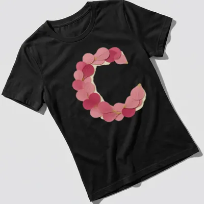 Vintage style t-shirt featuring a letter C formed from pink petals — printed on a women's shirt