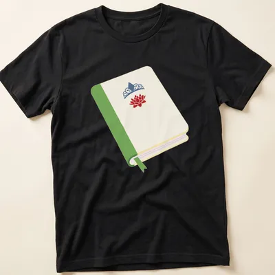 Illustrated t-shirt featuring a princess book with a lotus flower and crown in cream, green, red, and blue.