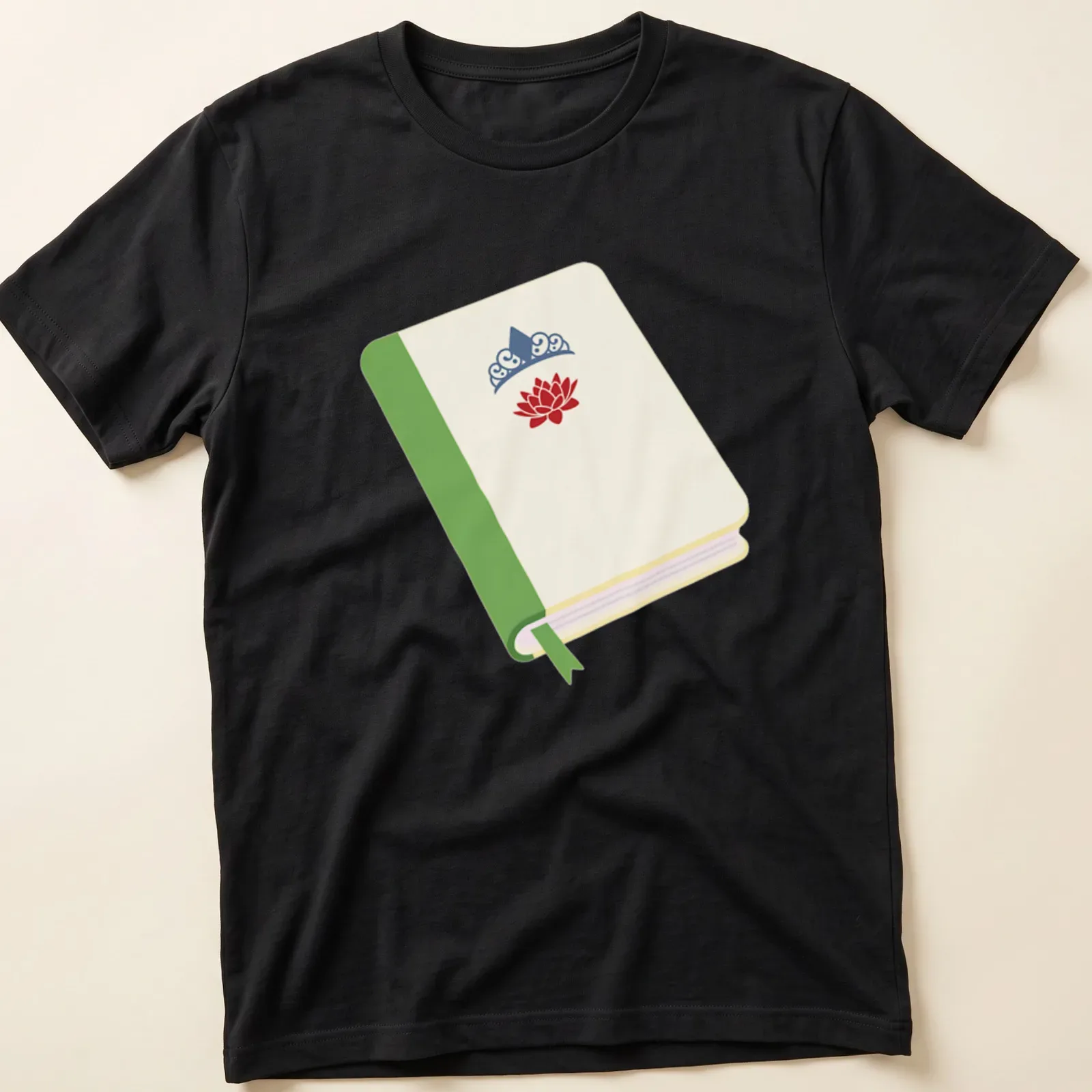 Illustrated t-shirt featuring a princess book with a lotus flower and crown in cream, green, red, and blue. — printed on a unisex t-shirt