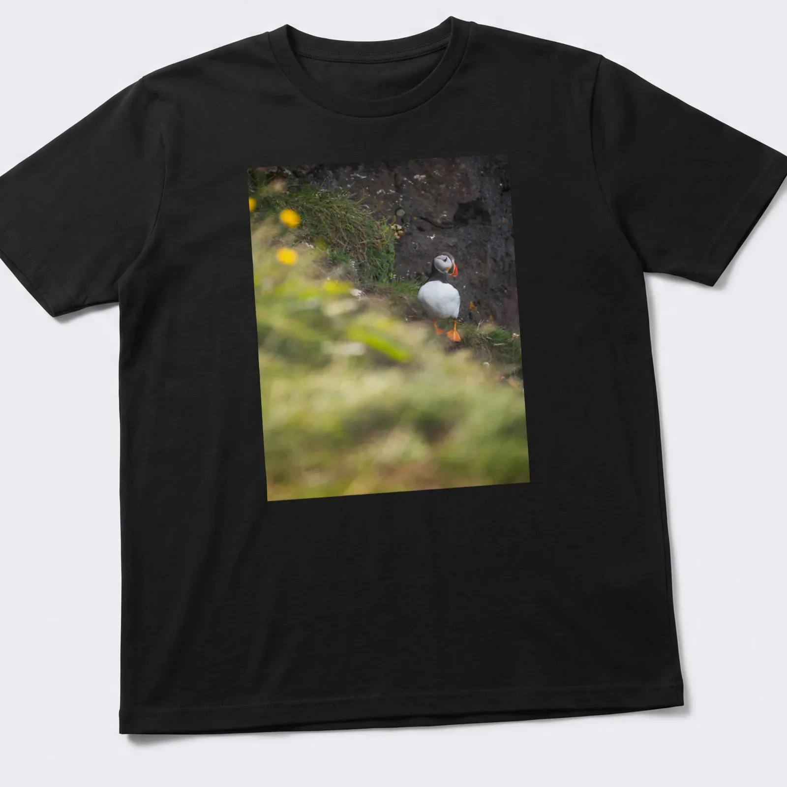 Natural photography of a puffin bird fishing, featuring vibrant colors — printed on a unisex t-shirt
