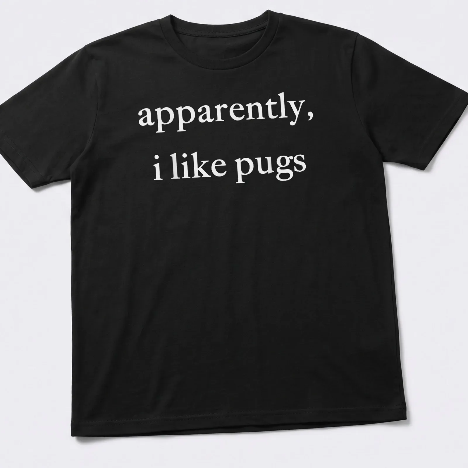 Simple text t-shirt with the phrase 'apparently, I like pugs' in white. — printed on a unisex t-shirt