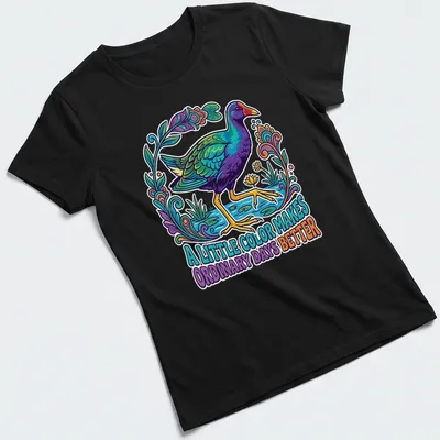 Illustration of a Purple Gallinule with vibrant colors and uplifting text — printed on a women's shirt