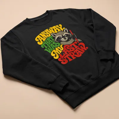 Colorful illustration of a raccoon with humorous text about its last straw. — printed on a unisex sweatshirt