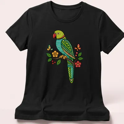 Gond art t-shirt featuring a Ring Necked Parakeet on a flowering branch — printed on a women's shirt