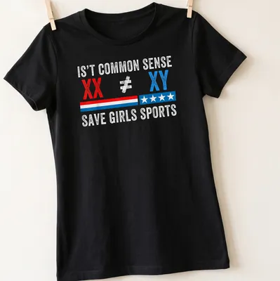 Bold distressed shirt with a statement on saving girls sports in red, blue, and white — printed on a women's shirt