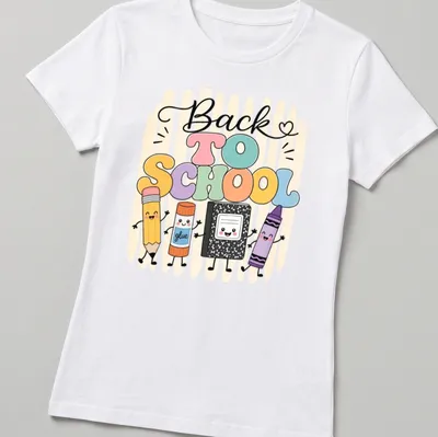Kawaii-style t-shirt featuring cartoon school supplies and 'Back To School' text — printed on a women's shirt