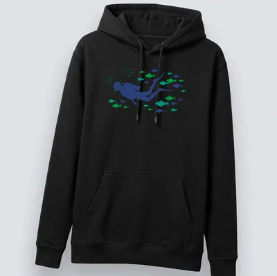 Woodcut style graphic of a scuba diver swimming with fish in blue and green tones — printed on a unisex hoodie