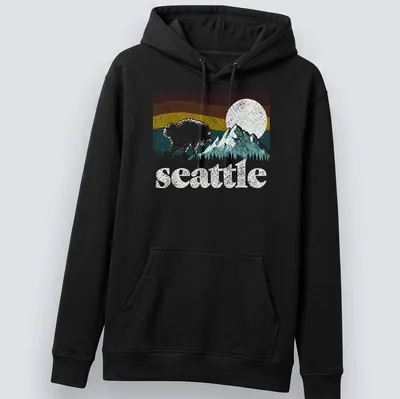 Retro bear graphic with Seattle text in pink, blue, yellow, and green — printed on a unisex hoodie