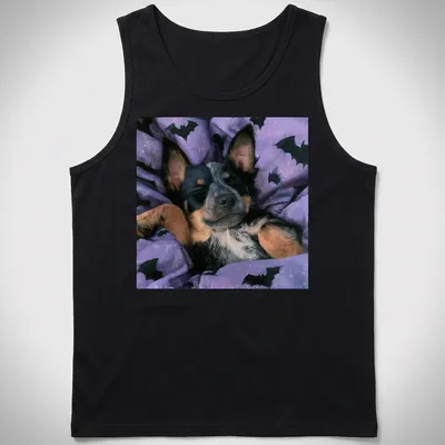 Realistic depiction of a sleepy Cattle Dog on a purple bat-patterned blanket — printed on a tank top