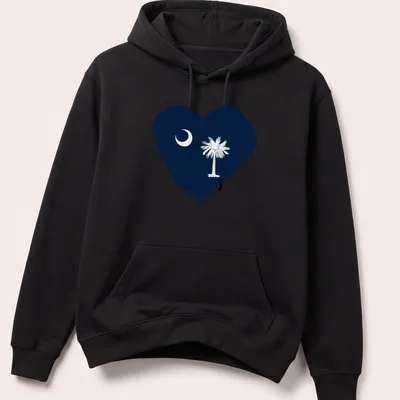Distressed graphic of South Carolina flag heart featuring crescent moon and palm tree — printed on a unisex hoodie